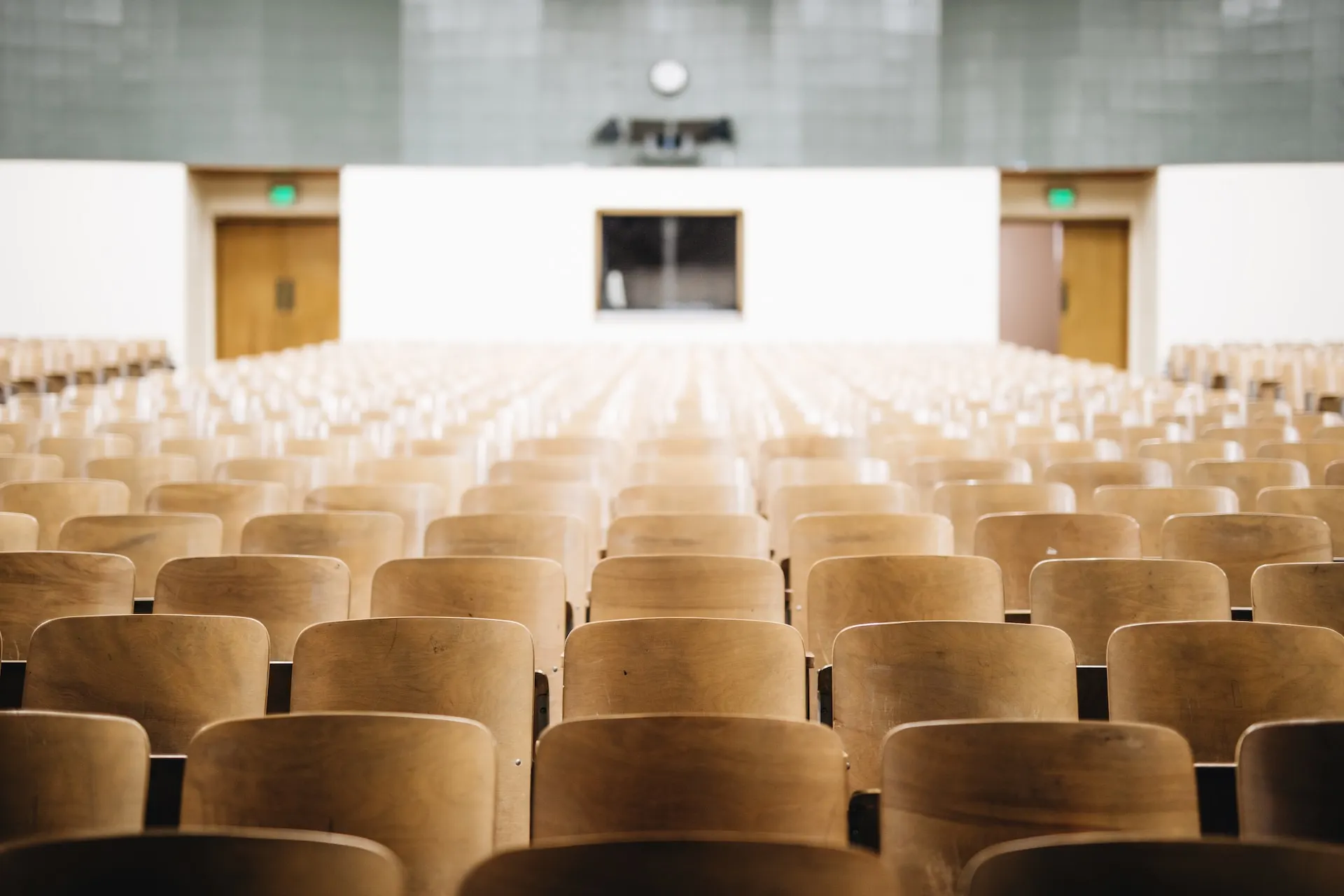 Empty hall with a lot of wooden chairs