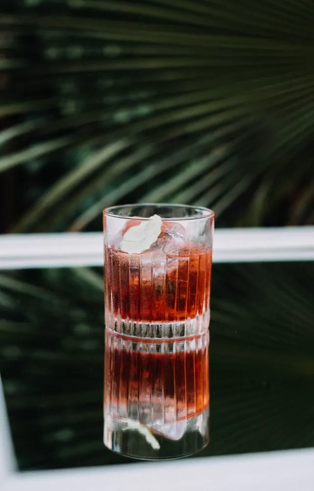 Orange drink in a glass with beautiful edges