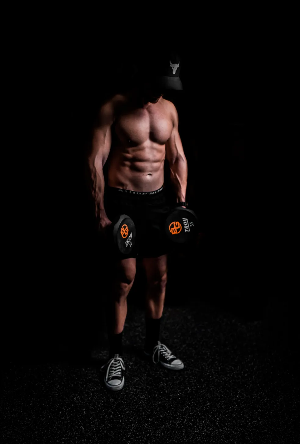 A man in dark shorts