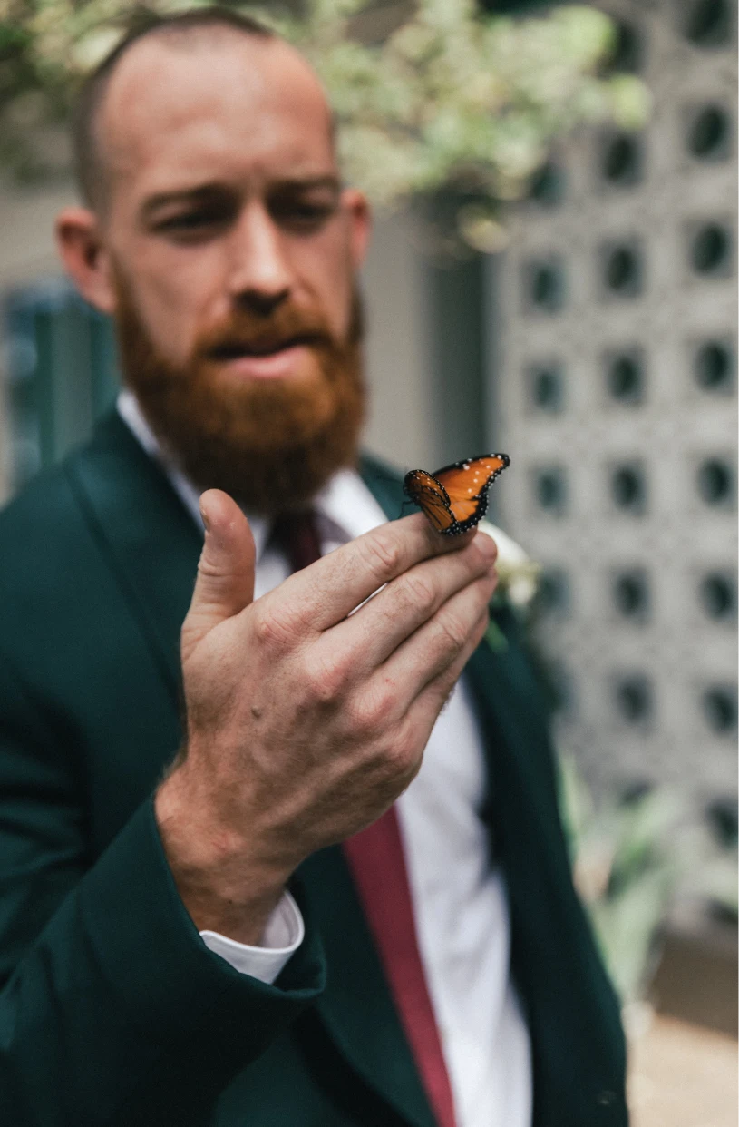 Man with a butterfly on his hand