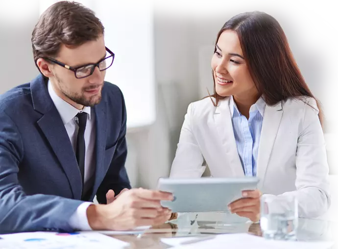 a guy and a girl holding a tablet