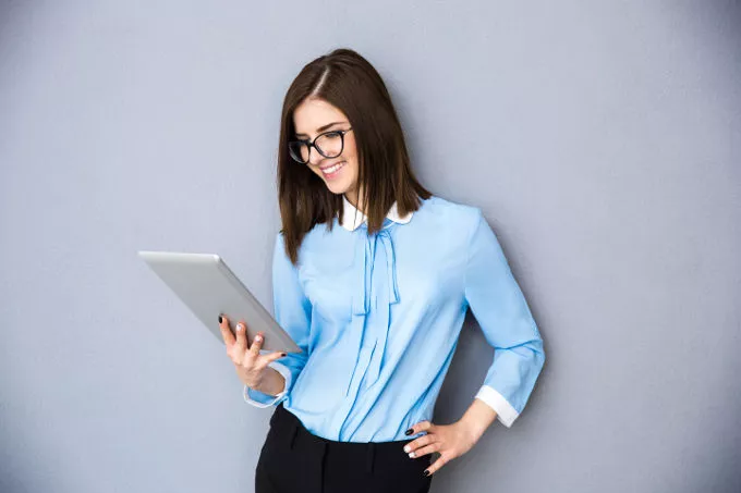 a guy and a girl holding a tablet
