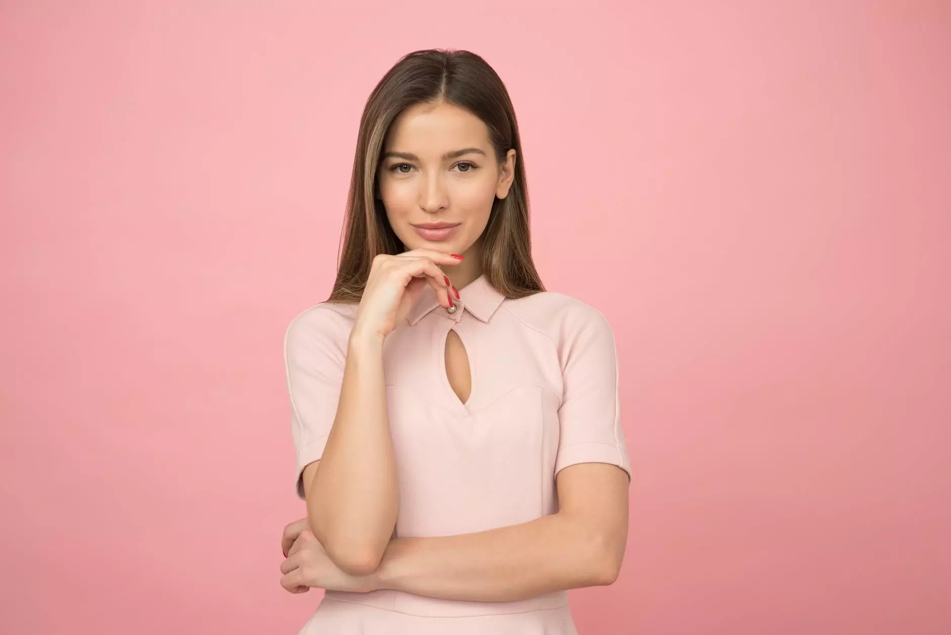 the girl holds her hand near her chin