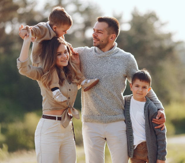 Happy family with two kids in the park
