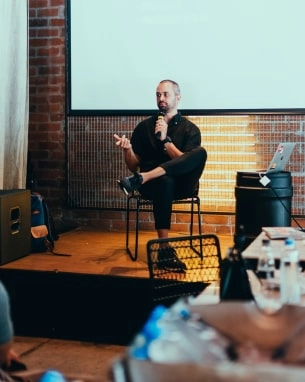 Man during presentation with people