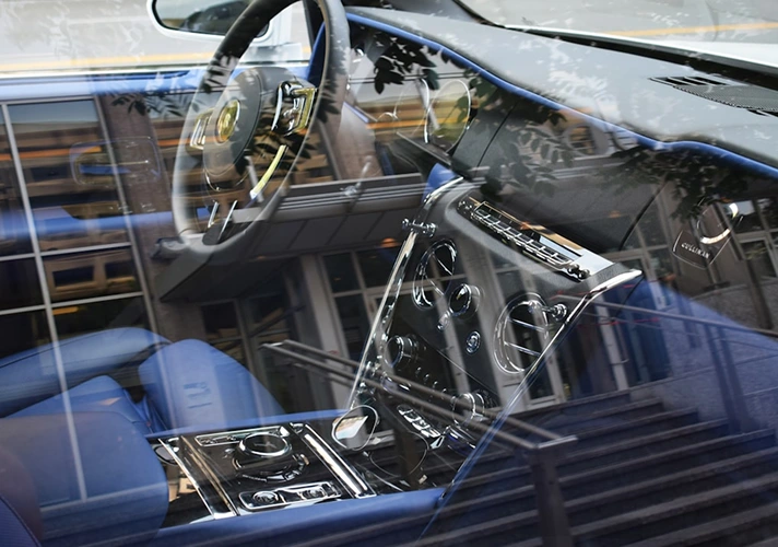 Car interior with leather seats and modern controls.