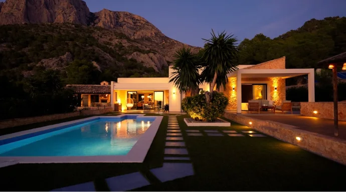 Meridian Villa luxury residential estate in Gdansk with a private swimming pool and outdoor lighting at dusk